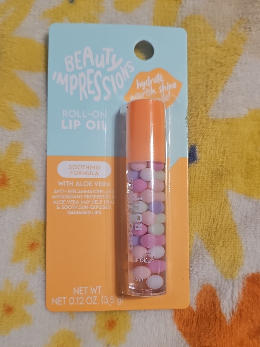 Impressions Roll-On Lip Oil in Orange Cap with Pastel Beads